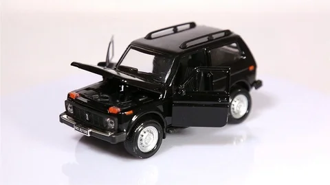 Black Niva scale model russian SUV car with opened doors and hood Stock Footage 102086592