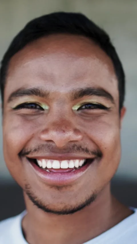 Black nonbinary, gender fluid man smiling at camera - Beauty portrait - Vertical Видео 331091064