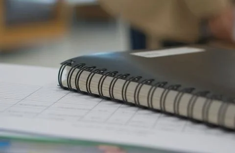 Black notebook and document in office Stock Photos