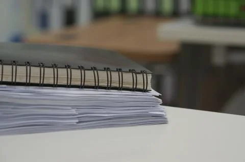 Black notebook and stack of data document Foto stock