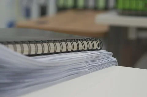 Black notebook and stack of white document Stock Photos