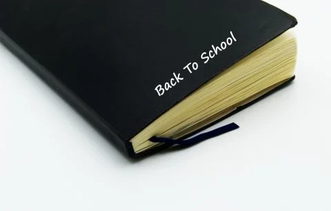 Black notebook isolated on white background. Back to school concept Stock Photos