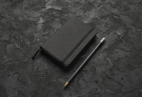 Black notebook, pencil Stock Photos