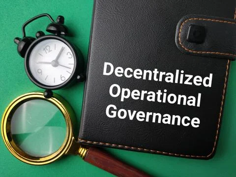 A black notebook reading Decentralized Operational Governance lies with a m.. Stock Photos