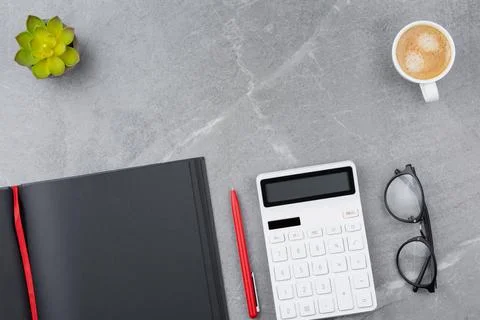 Black notepad on marble background. Stock-Fotos