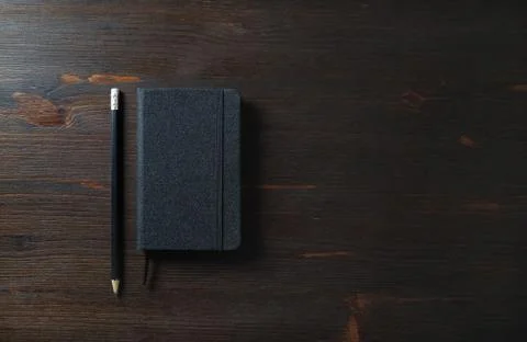Black notepad, pencil Foto stock