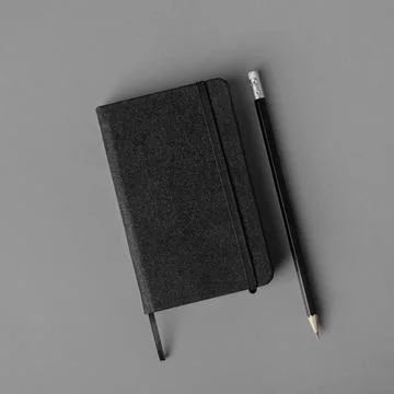 Black notepad, pencil Stock Photos