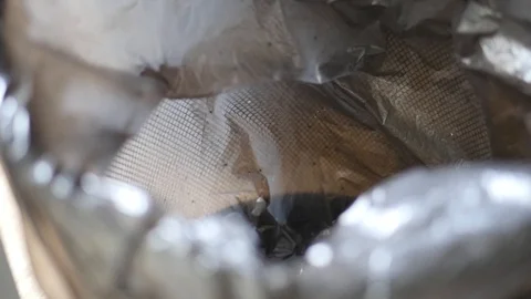 Black nylon bag in trash can Stock Footage 88828285