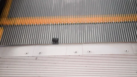 Black Object Rotating on a Moving Elevator with Yellow Markings Video stock 285845781