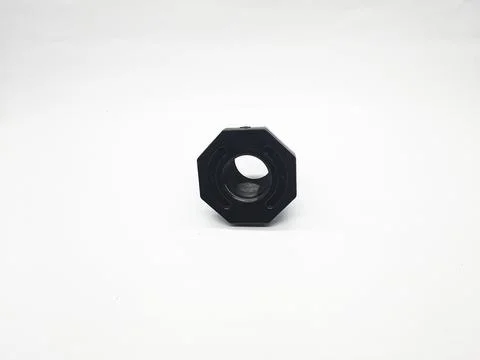 Black octagonal fitting component isolated on a clean white background Stock Photos
