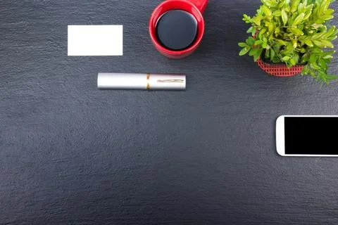 Black Office desk table with computer, pen and a cup of coffee, lot of thin.. Stock Photos