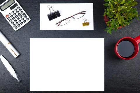 Black Office desk table with computer, pen and a cup of coffee, lot of thin.. Stock Photos