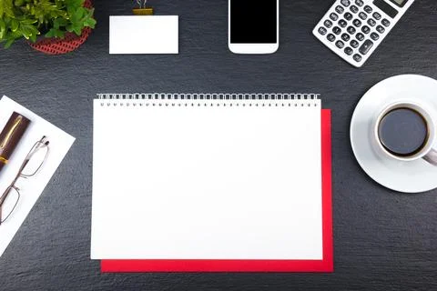 Black Office desk table with computer, pen and a cup of coffee, lot of thin.. Stock Photos