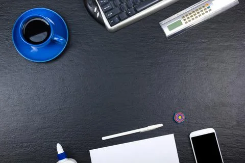 Black Office desk table with computer, pen and a cup of coffee, lot of thin.. Stock Photos