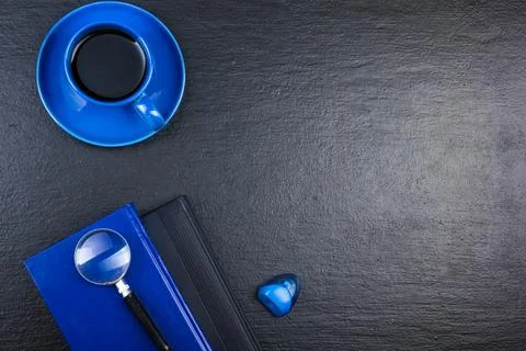 Black Office desk table with computer, pen and a cup of coffee, lot of thin.. Stock Photos