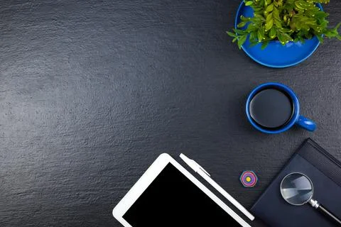 Black Office desk table with computer, pen and a cup of coffee, lot of thin.. Stock Photos