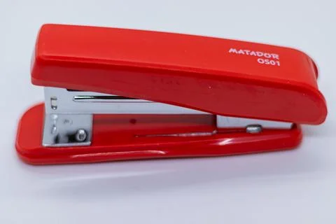 Black office stapler machine on white background Stock Photos