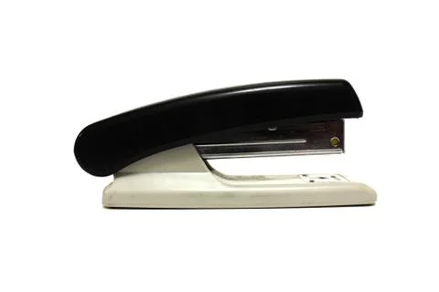 Black office stapler on white background Stock Photos