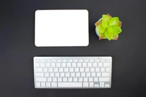Black office table with computer, pen and a cup of coffee, lot of things. T.. Foto stock