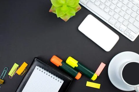 Black office table with computer, pen and a cup of coffee, lot of things. Top Stock Photos