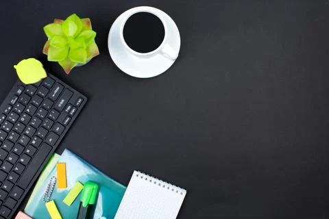 Black office table with computer, pen and a cup of coffee, lot of things. Top Stock Photos