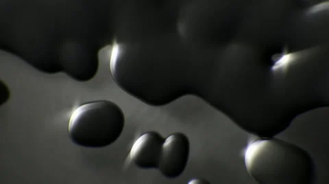 Black oil droplets close up falling down slow motion Stock-Footage 61672539