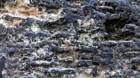 Black, old, brick texture. Stock Photos