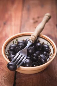 Black olive in dish Stock Photos