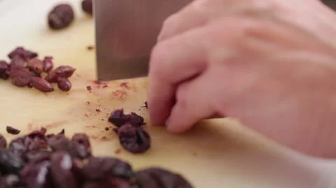 Black olive - pit removing Stock Footage 58529164
