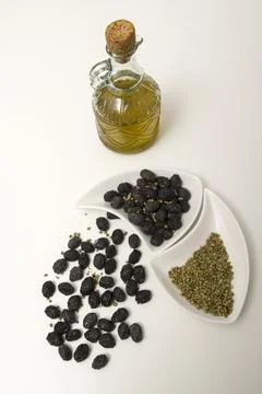 Black olives and oil Stock Photos
