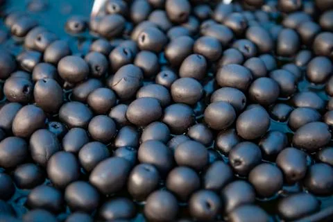Black olives in brine Stock Photos