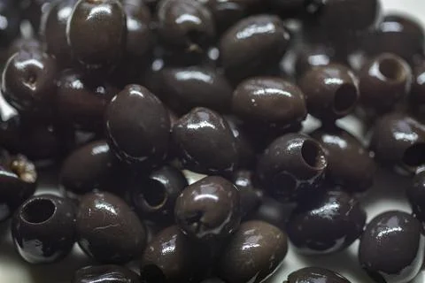 Black olives ready to serve on plate Stock Photos
