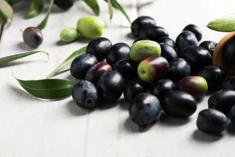 Black Olives on a white table Stock Photos