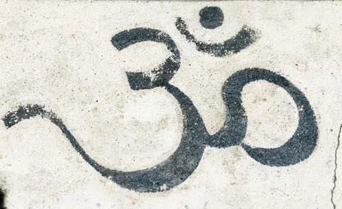 Black om on a white wall Stock Photos