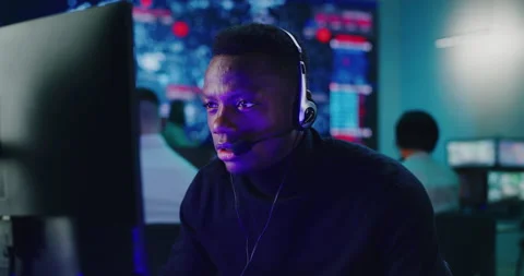 Black operator using computer in hi tech security center Stock Footage 148241687