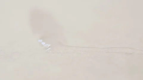 Black Paint Drops Make Patterns with Water Macro Stock Footage 73085624