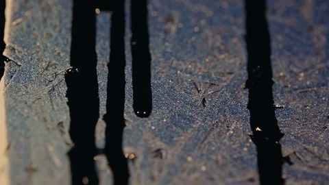 Black paint flows down the colored wall Video stock 82872236