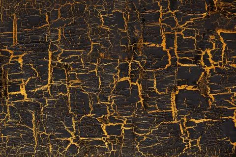 Black paint with gold crackles Stock Photos