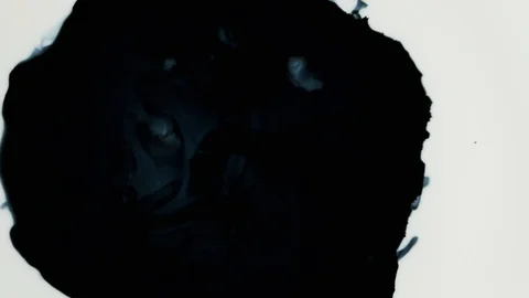 Black paint or ink drops on a white background. Video stock 120695591