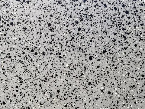 Black Paint Splatter Pattern on Light Gray Background Stock Photos