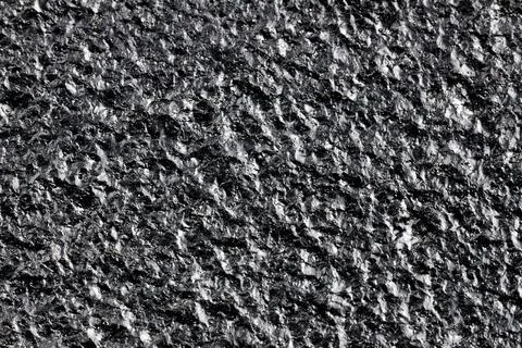 Black painted cast iron texture surface background macro close up rough metal Stock Photos