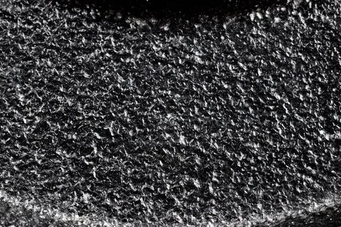 Black painted cast iron texture surface background macro close up rough metal Stock Photos