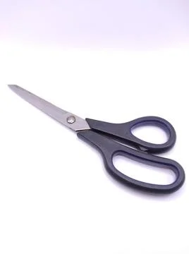 A black pair of scissors for cutting Foto stock