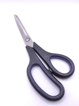 A black pair of scissors for cutting Stock Photos