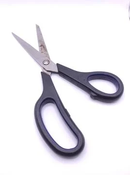 A black pair of scissors for cutting Foto stock