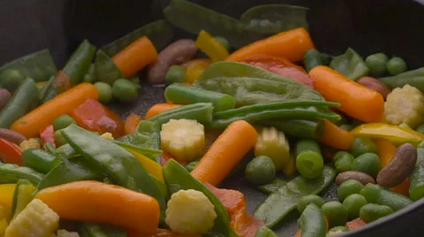 Black pan with different vegetables and oil Stock Footage 61801252