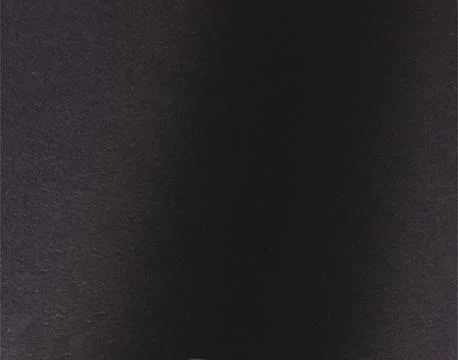 Black paper background with a subtle gradient and matte surface. Smooth shado Foto stock