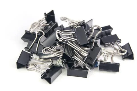 Black paper clips isolated on white Stock Photos
