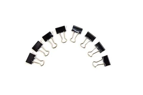 Black Paper clips, isolated on white background. Stock Photos