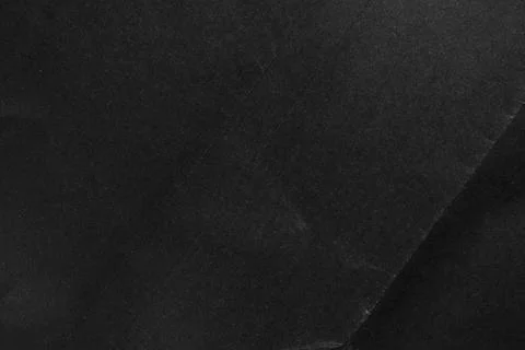 Black paper textured surface with a subtle fold and unique natural pattern Stock Photos